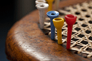 Detail of a dining chair being recaned in E & A Wates' workshop.